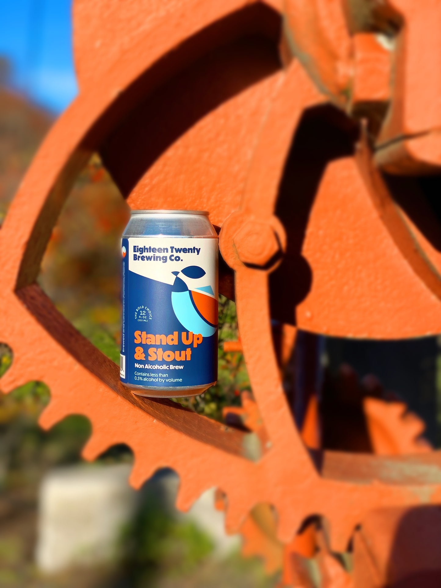 A can of Stand Up & Stout on an orange gear